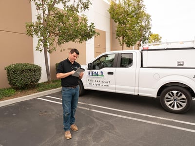 An AIPM pest control professional
