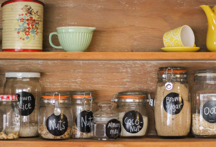 A pantry with jars and ceramic wares