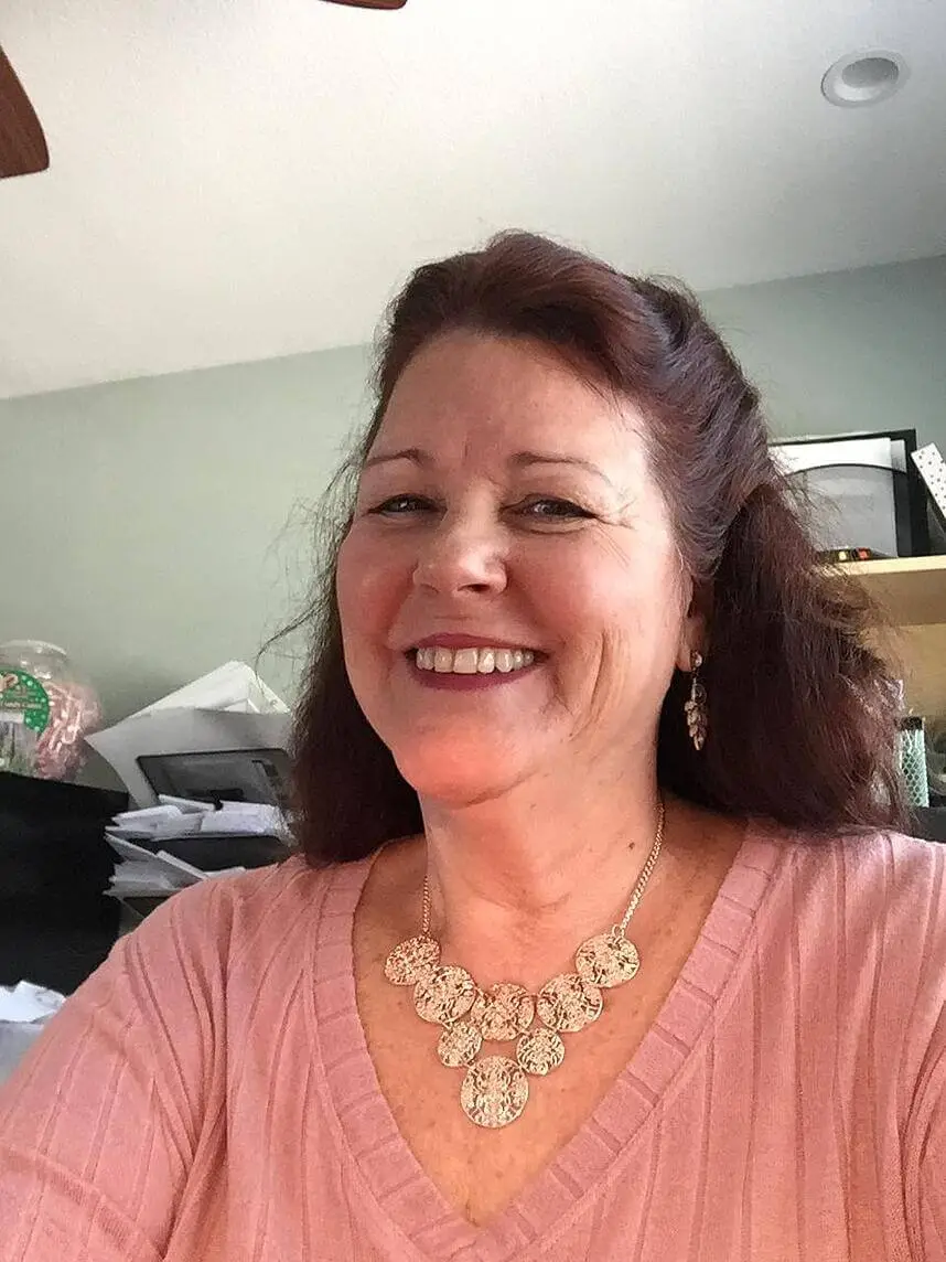 a woman smiling for selfie